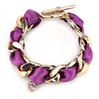 Stylish purple chain link bracelet for women featuring gold accents and a decorative charm