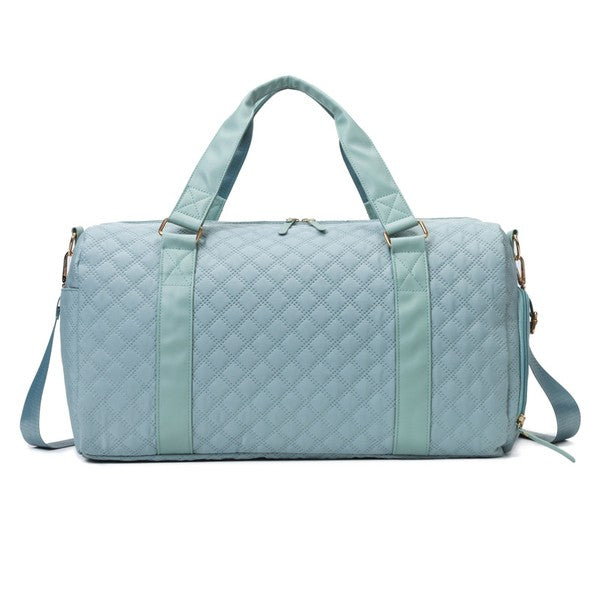 Aili's Corner quilted weekender bag for women in light blue with sturdy handles and adjustable strap