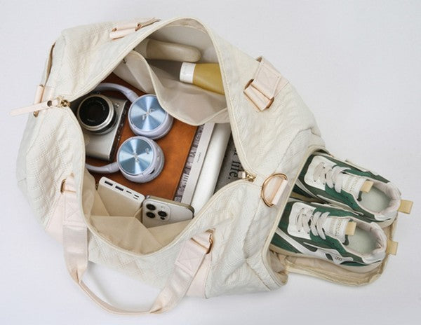 Aili's Corner quilted weekender bag for women packed with sneakers and accessories for travel
