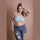 Leto Accessories racerback bralette plus size in light green, styled with distressed jeans for a chic look
