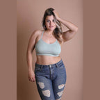 Leto Accessories racerback bralette plus size in light green, styled with distressed jeans for a chic look