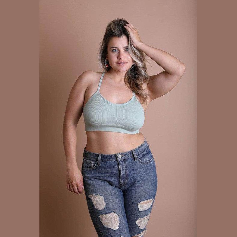 Leto Accessories racerback bralette plus size in light green, styled with distressed jeans for a chic look