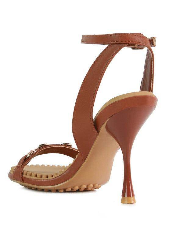 Stylish brown women's heels featuring a strappy design and a high stiletto for elegant occasions