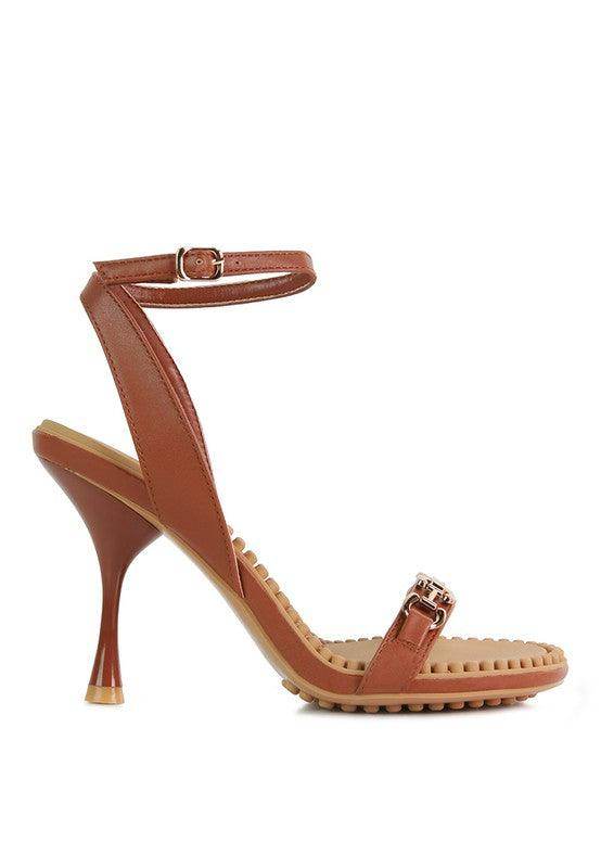 Stylish brown women's heels with a strappy design and a high heel, perfect for formal occasions