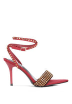 Women's red high heeled diamante sandals with elegant gold accents