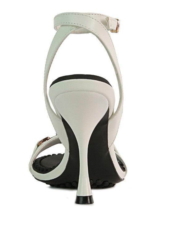 Back view of black strappy heels with a sleek design and elegant stiletto heel