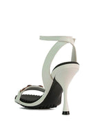 Stylish black strappy heels with a sleek design and elegant ankle strap for women
