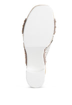 Bottom view of chunky heel raffia sandals from Rag Company showing the white sole and heel