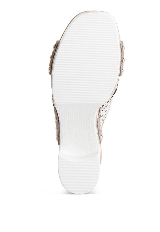 Bottom view of chunky heel raffia sandals from Rag Company showing the white sole and heel