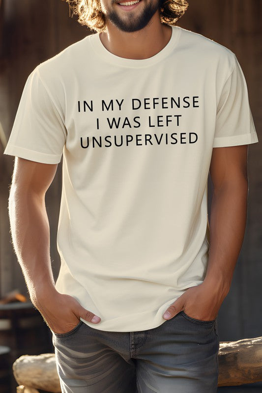 Beige novelty coworker tee with the phrase In My Defense I Was Left Unsupervised displayed prominently