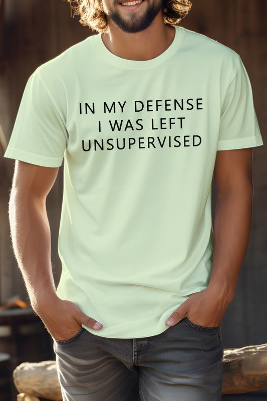 Novelty coworker tee featuring humorous text 'In my defense I was left unsupervised' in light color