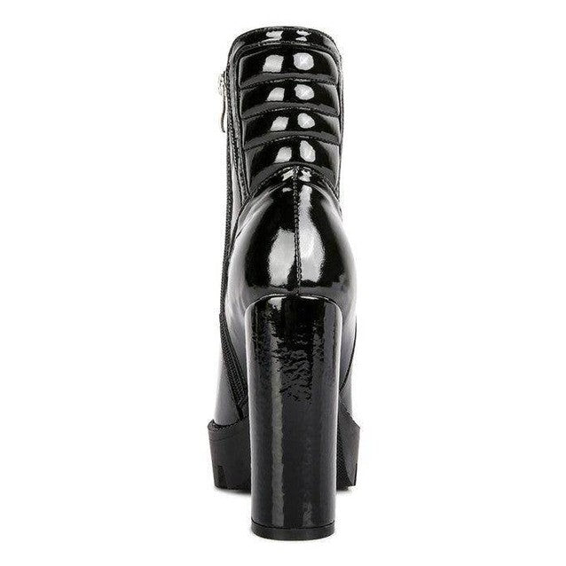 Women's black patent leather high heel boots for stylish outings