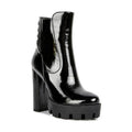 Women's black shiny high heel boots for fashionable outings
