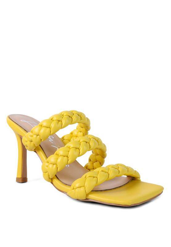 Stylish yellow heels with braided straps, perfect for summer outings and featuring a chic design