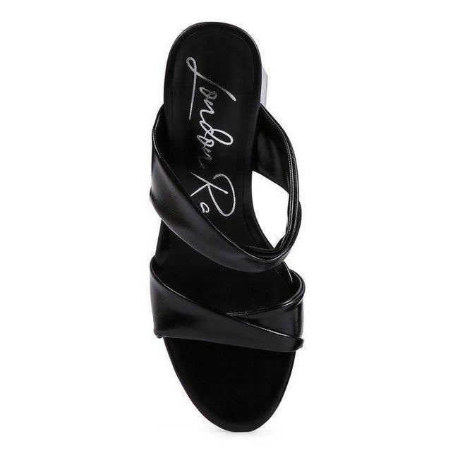 Stylish black cross strap sandals perfect for pairing with dresses, not red high heeled sandals