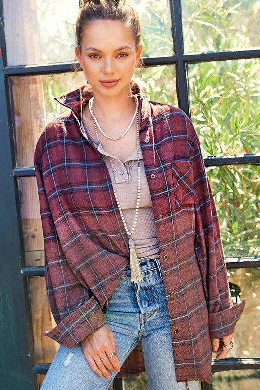 La Miel red plaid casual shirt styled with a basic top and jeans in a bright outdoor setting