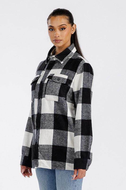 Stylish women's black and white checkered oversized shacket perfect for layering in cooler weather