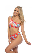 Beach Joy Bikini red tropical one shoulder bikini with vibrant floral pattern on a smiling woman