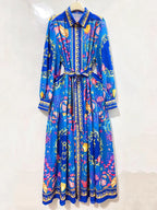 Detail view of retro coastal print maxi dress showing collar and button placket