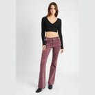 Emory Park retro style low rise pants in burgundy, styled with a black crop top for a trendy look