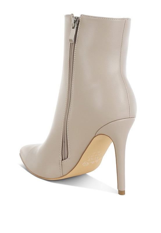 Stylish beige rhinestone chain ankle boots with a sleek stiletto heel and zip closure