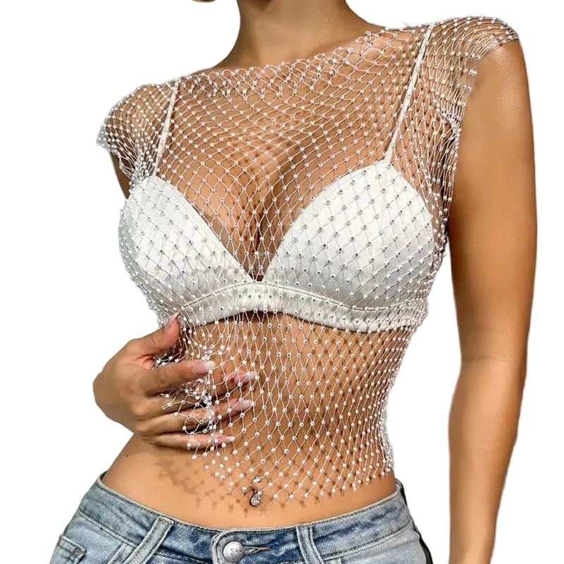 Rhinestone fishnet crop top shell only with sparkling bead details over white bra and jeans