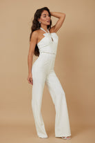 Elegant women's rhinestone halter neck jumpsuit in white, perfect for chic summer events