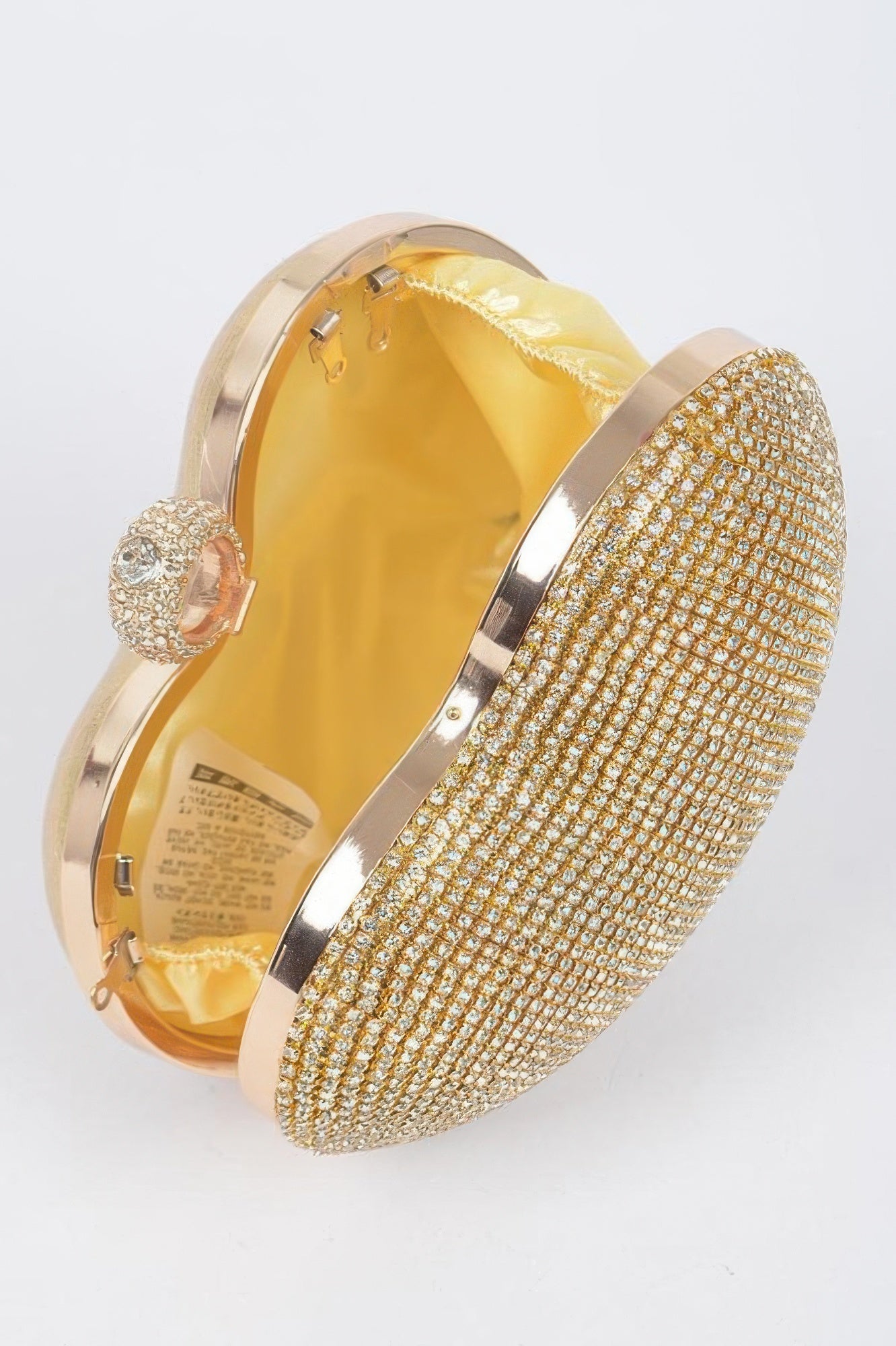 Rhinestone heart shape clutch with gold detailing and yellow satin interior for elegant evening wear