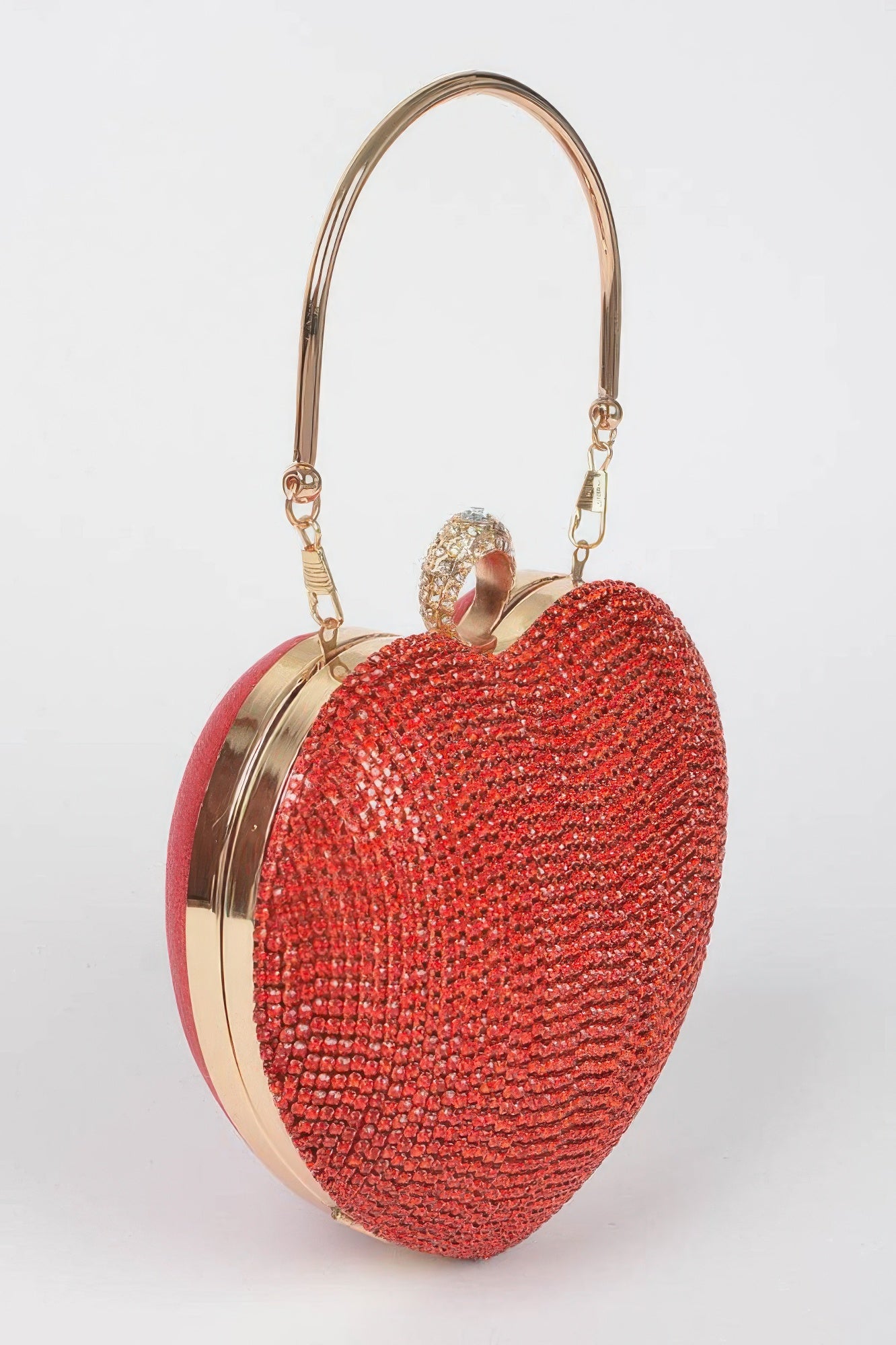 Rhinestone heart shape clutch in red with a gold handle and decorative closure for a stylish accessory