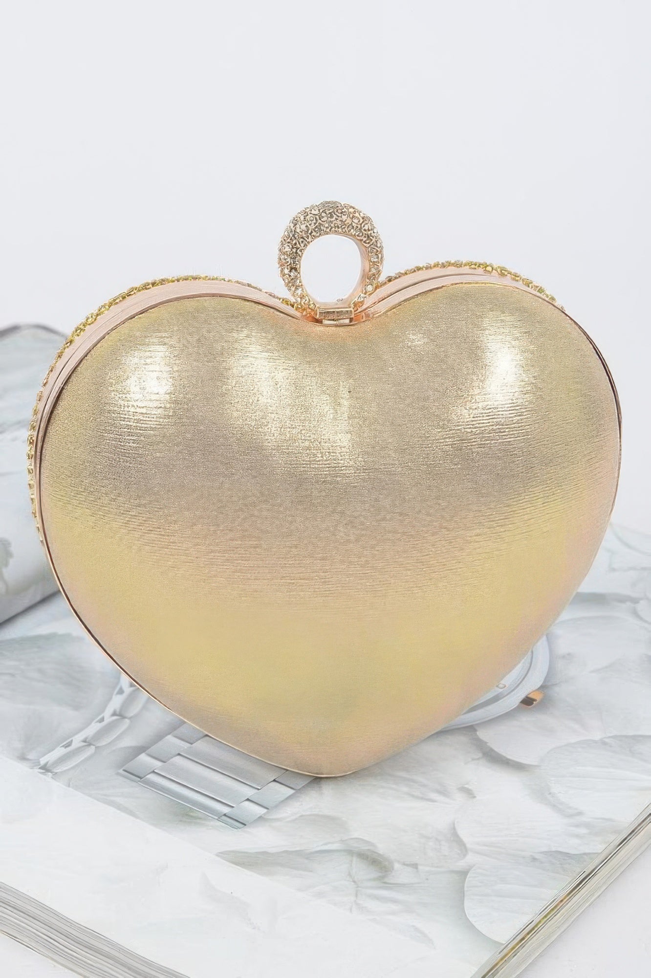 Gold rhinestone heart shape clutch with a unique metallic finish and elegant design for special occasions