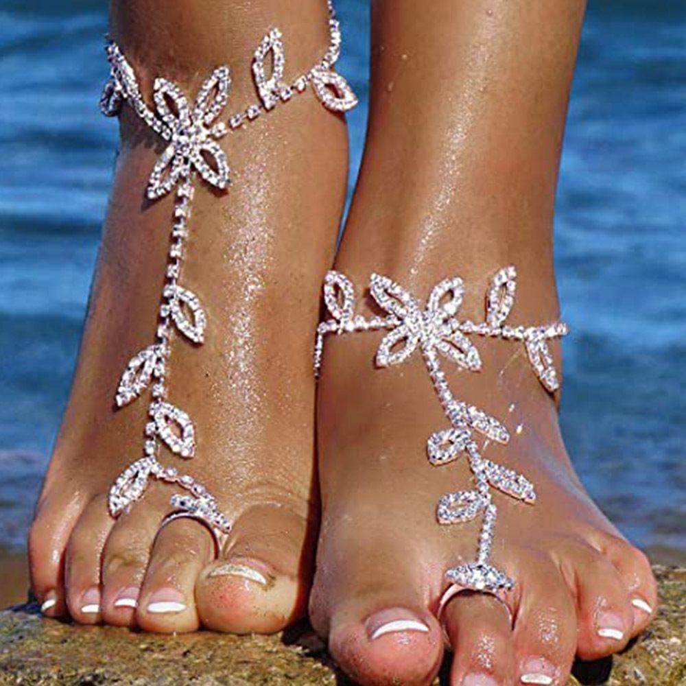Elegant rhinestone toe ring jewelry featuring floral designs, perfect for summer beach outings