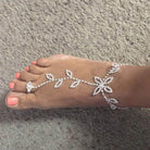 Elegant rhinestone toe ring jewelry featuring a floral design for stylish summer footwear