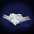 Elegant rhodium 925 sterling silver ring featuring a heart-shaped design with sparkling stones