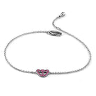 Rhodium brass butterfly bracelet featuring a pink heart charm with sparkling stones for trendy style