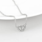 Delicate rhodium crystal heart necklace featuring shimmering crystals for elegant style