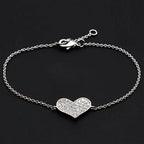 Rhodium heart bracelet for women featuring a sparkling heart charm on a delicate chain