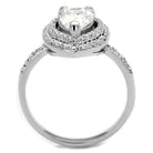 Stunning rhodium plated silver engagement ring with a sparkling center stone and intricate detailing