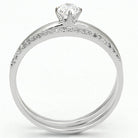 Elegant rhodium plated sterling silver ring with a sparkling center stone and accent diamonds