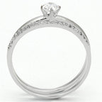 Elegant rhodium plated sterling silver ring with a sparkling center stone and accent diamonds