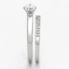 Elegant rhodium plated sterling silver ring with a sparkling center stone and pave band detailing