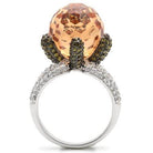 Rhodium statement cocktail ring featuring a large peach gemstone and sparkling accents for elegant style