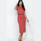 Woman wearing Capella ribbed midi skirt set in a dusty rose color with short sleeves and fitted silhouette