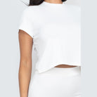 Capella white ribbed midi skirt set featuring a cropped short sleeve top and high-waisted skirt