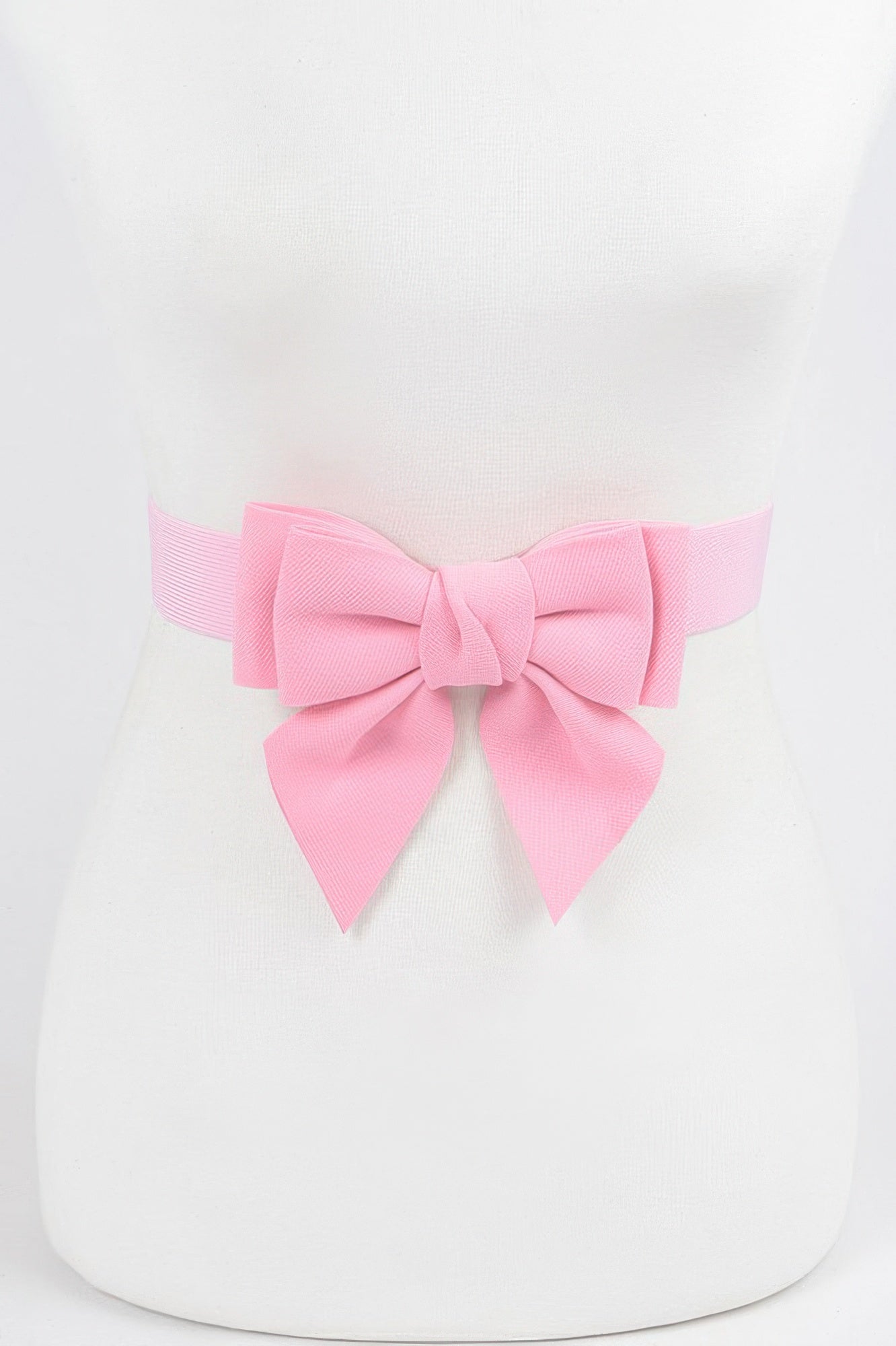 Girls pink ribbon buckle stretch belt featuring a large bow for a stylish accessory