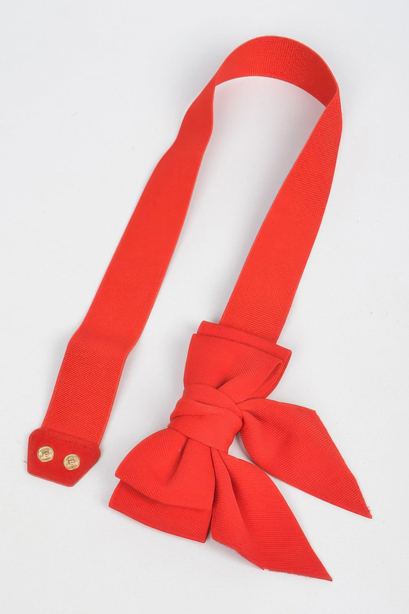 Bright red ribbon buckle stretch belt with a stylish bow design for women's fashion