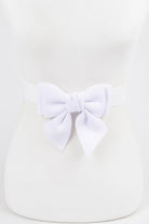 White ribbon buckle stretch belt with a large bow for a stylish and feminine accessory