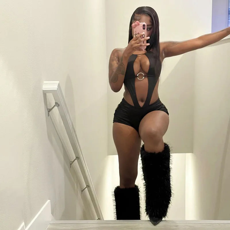 Black romper halter with sheer detail, perfect for stylish nights out
