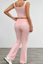 Back view of a pink ruched summer outfit for women featuring a fitted tank and flared pants