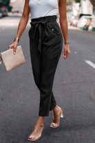 Stylish black ruffle belt skinny pants for women, perfect for any casual or formal outing