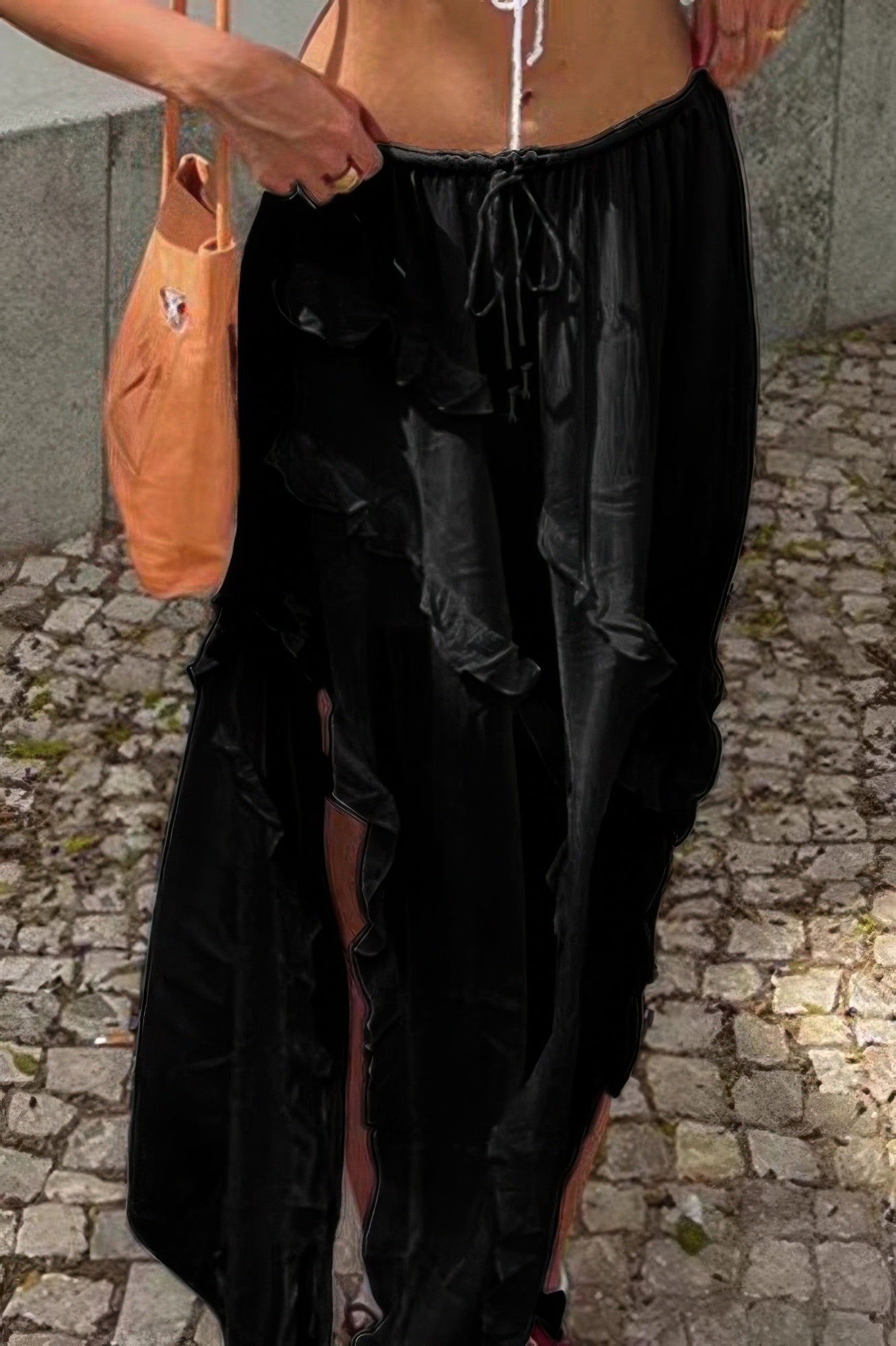 Black ruffle drawstring waist skirt with side slits for a stylish summer look